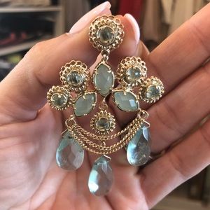Gold and blue-green chandelier earrings.